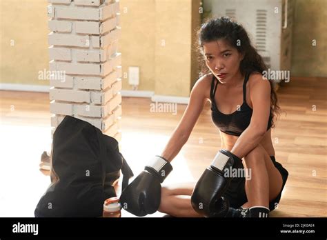 Female Vietnamese young boxer tired after intense training Stock Photo ...