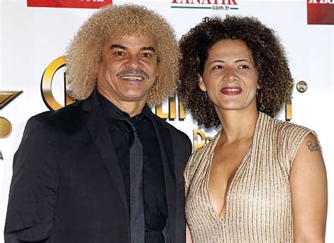 Colombia's former football player Carlos Valderrama poses with his wife ...