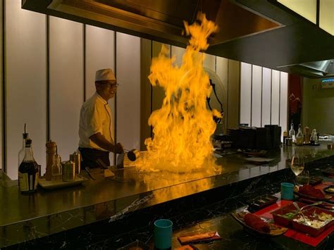 premium photo fire  kitchen  chef preparing food  restaurant