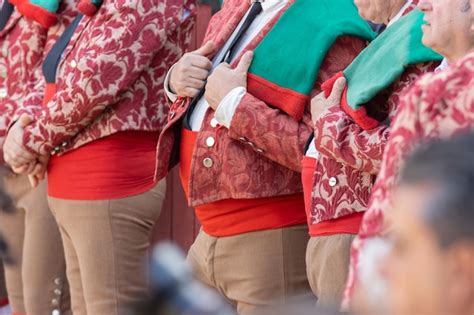 premium photo forcados   suits stand   arena   row