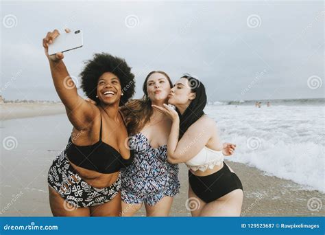 Beautiful Curvy Women Taking A Selfie At The Beach Royalty-Free Stock