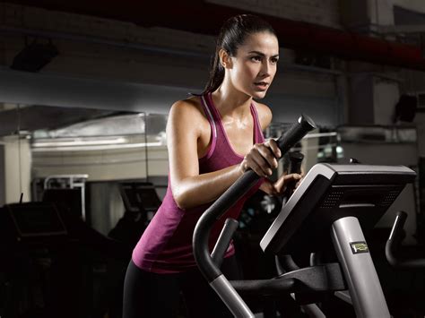 Download Fit Woman Running On Treadmill Wallpaper | Wallpapers.com