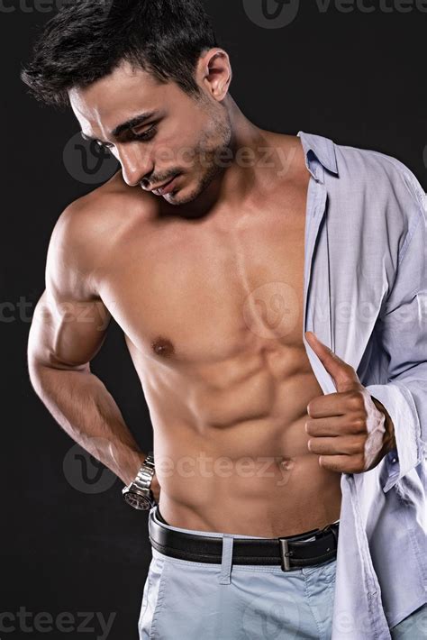 Handsome Arab male model with perfect body posing in studio. Portrait