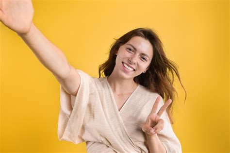 Premium Photo | Happy young caucasian woman in casual taking selfie and ...