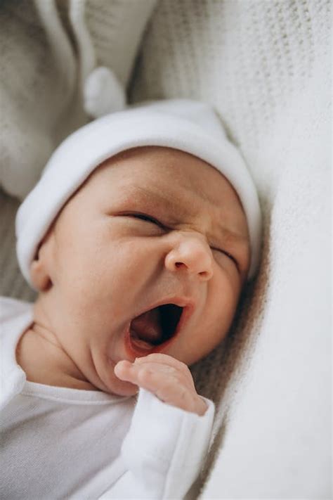 Baby in a Blanket Yawning · Free Stock Photo