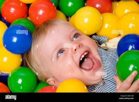 laughing child  ball pit stock photo alamy