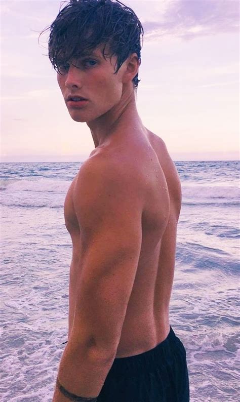 symbolic beach photography poses  men macho vibes