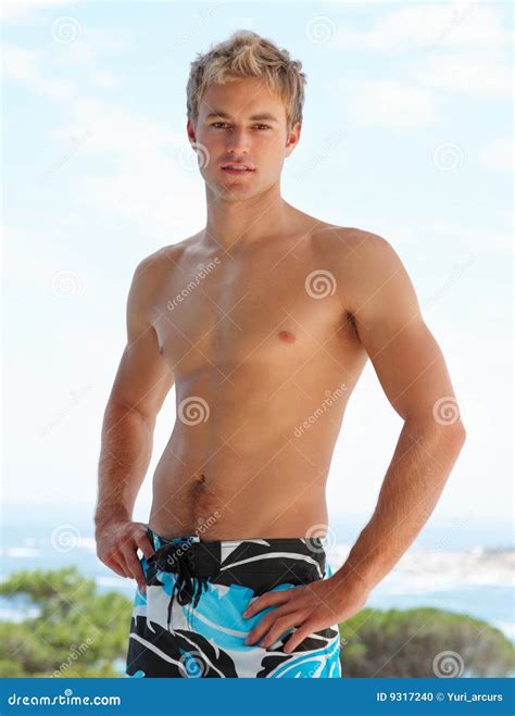 Stock Photo: Portrait of handsome shirtless man. Image: 9317240