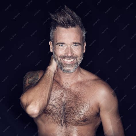 Premium Photo | Macho and rugged portrait of mature man posing against