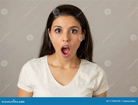 young attractive woman surprised shocked face eyes mouth wide open