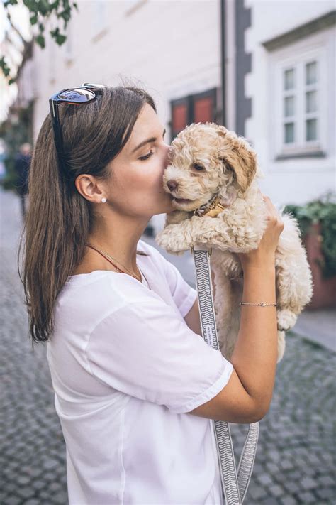 Download Passionate Bond - A Woman With Her Dog Wallpaper | Wallpapers.com