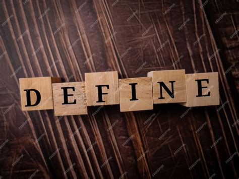 Premium Photo | Wooden cube with word define on a wooden table background