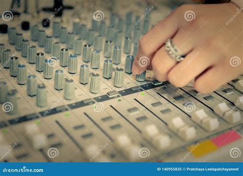 Engineer or Music Producer Controlling Sound Recording Studio Mixing