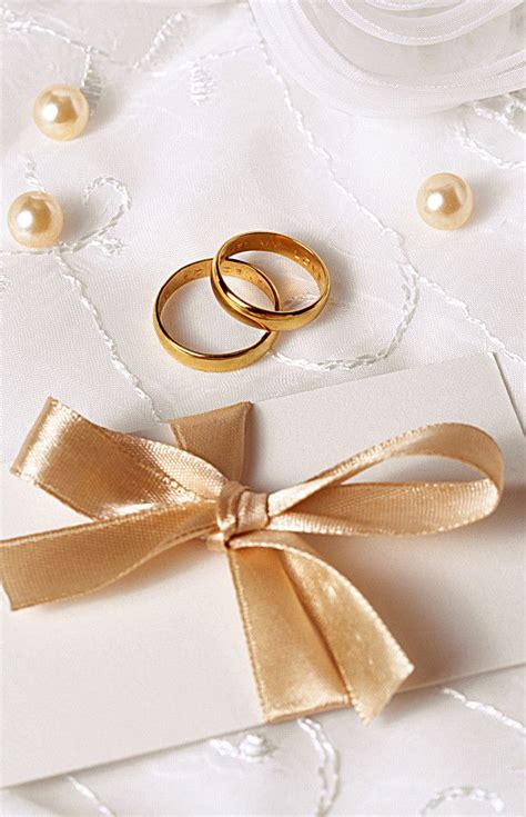 Gold Celebration Wedding Rings on White Card with Gold Ribbon and Pearls