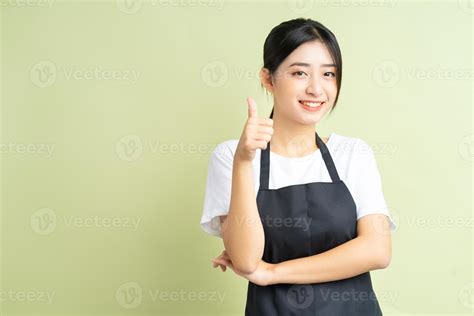 Asian waitress gives thumbs up 2866991 Stock Photo at Vecteezy