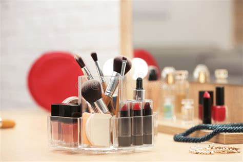 Organizer with Cosmetic Products and Makeup Accessories on Table Stock ...