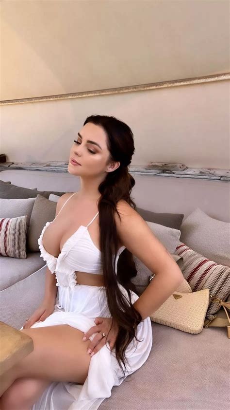 Demi Rose lets gems cascade over her boobs as she strips nearly naked