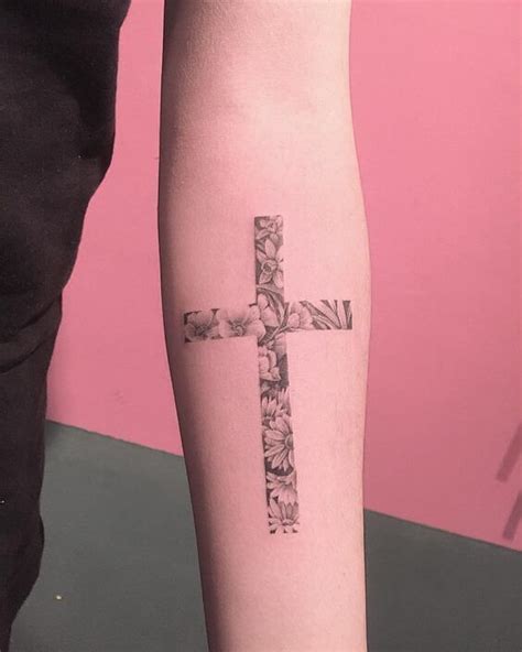 This large inking of a cross is located on the inner forearm, although ...