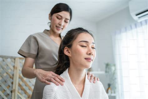 Close up of young client girl feel relaxed during leg massage with oil