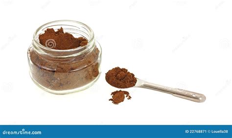 Heaping Spoon Of Allspice And Jar Stock Image - Image: 22768871