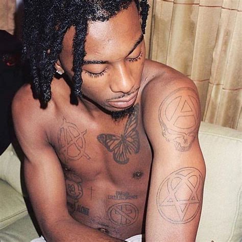 Playboi Cartis Tattoo Aesthetic The Brushstrokes Of A Hiphop Icons Identity