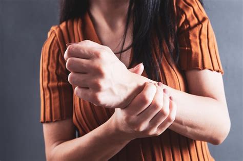 Premium Photo | A young girl has a sore wrist 