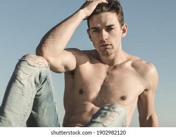 sexy topless handsome male model posing stock photo