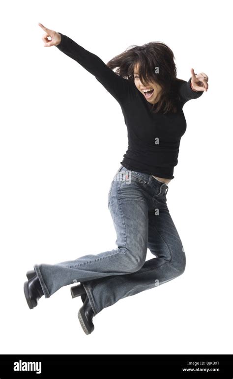 casually dressed woman leaping stock photo alamy