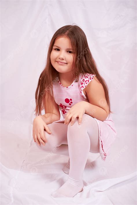 Little Girl Sitting On His Haunches Fun Carefree Baby Photo Background