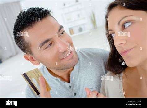 encouraging  girlfriend  spend money stock photo alamy