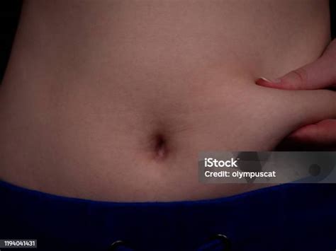 part  female belly  excess fat close   starting  gain weight