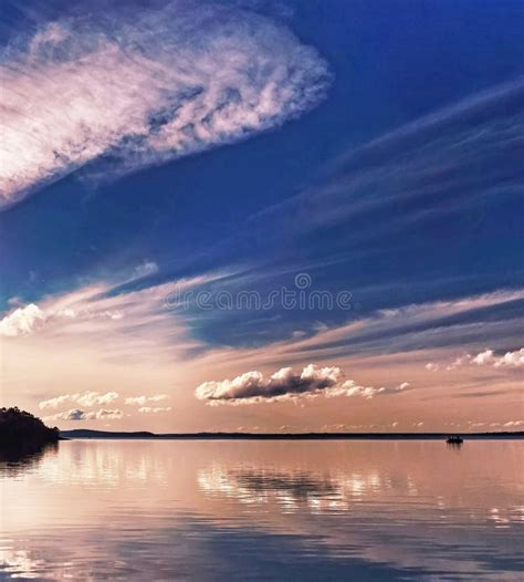 pale pink coloured cirrus cloud sunset seascape stock image image