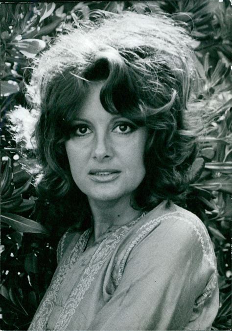 Italian film actress Rossana Podesta poses for a photograph at an even