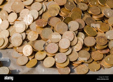 Many nepali coins piling up Stock Photo - Alamy