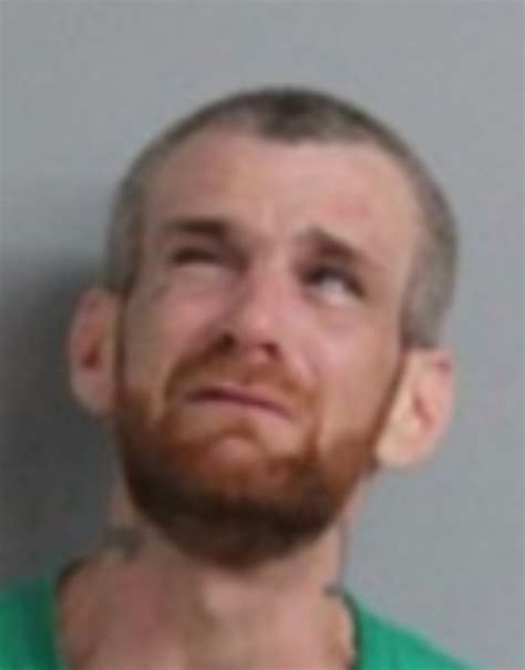 Wanted man arrested for wandering through Thompson backyards, hiding