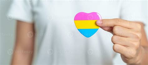 Pansexual Pride Day and LGBT pride month concept. hand holding pink