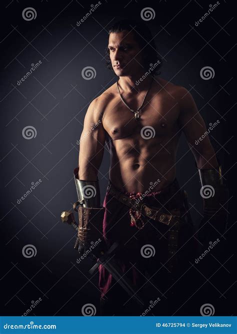 Naked Warrior Carrying Steel Sword, Painted Face Stock Image