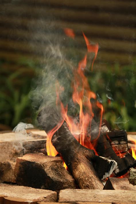 burning wood  rocks  stock photo