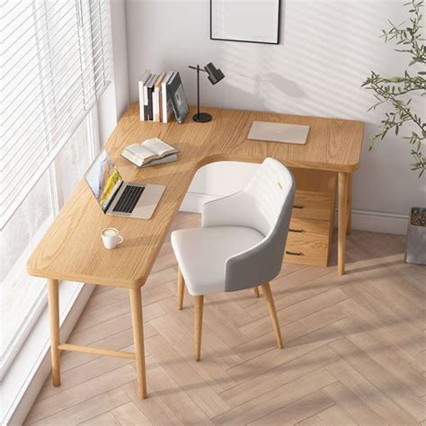 a wooden desk with two chairs and a laptop computer on it, in front of ...