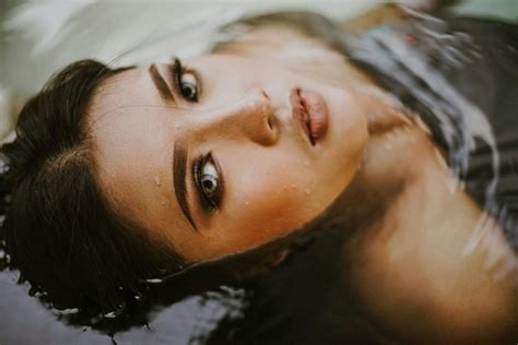 woman floating face   water      woman