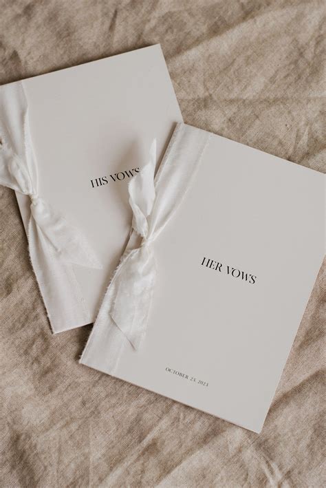 Modern vow booklets on luxury stone paper with silk habotai ribbon