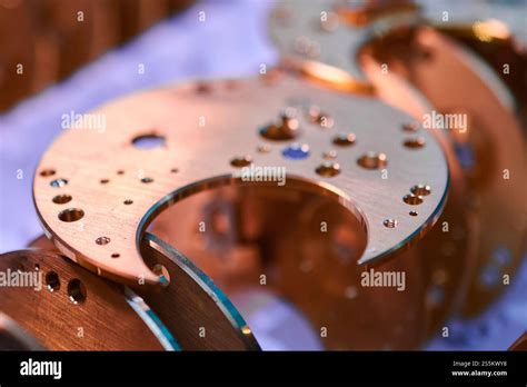 Intricate watch mechanism bases crafted in a metalworking workshop ...