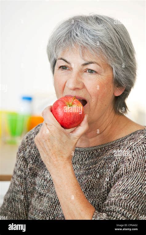 ELDERLY PERSON EATING FRUIT Stock Photo - Alamy