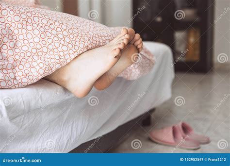 Feet girls under a blanket stock image. Image of flat - 152952547