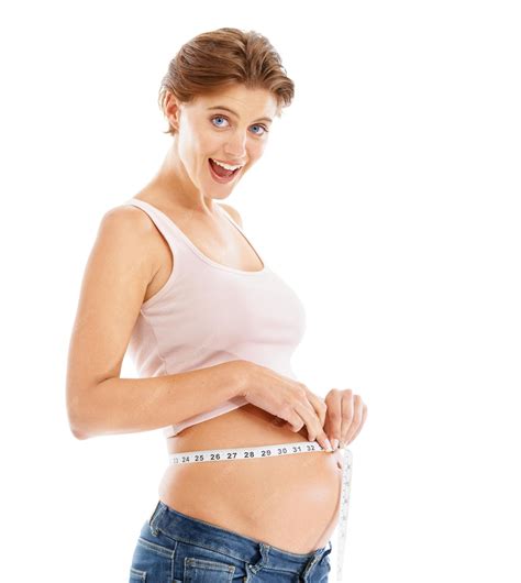 Premium Photo | Portrait of happy pregnant woman with measuring tape on