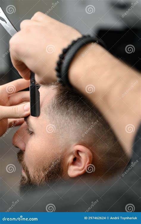 The Barber Makes the Outline with a Dangerous Razor the Undercut ...