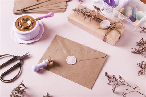 Craft Envelope with Wax Seal and Crafting Items on Pink Stock Photo ...