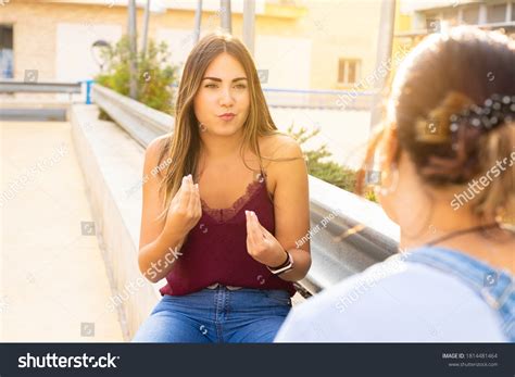 girls speaking sign language public stock photo