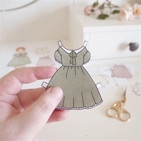I made a paper doll called Rose with a cottagecore inspired wardrobe