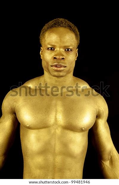 man painted gold showing   stock photo edit